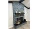 Stone fireplace with a modern mantel and hearth at 4010 Winderlakes Dr, Orlando, FL 32835