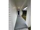 A covered front porch with a blue door and white siding at 4010 Winderlakes Dr, Orlando, FL 32835