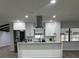 Modern kitchen island with white quartz countertop at 4010 Winderlakes Dr, Orlando, FL 32835