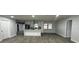 Modern kitchen with white cabinets, stainless steel appliances, and a large island at 4010 Winderlakes Dr, Orlando, FL 32835