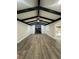 Bright living room with vaulted ceiling, fireplace, and wood-look flooring at 4010 Winderlakes Dr, Orlando, FL 32835