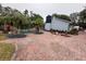 View of house and pool area with landscaping at 4010 Winderlakes Dr, Orlando, FL 32835