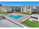 Aerial view of coastal community featuring pool, beach access, and green space at 4175 S Atlantic Ave # 4070, New Smyrna Beach, FL 32169