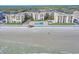 Aerial view of beachfront condo building with pool and ocean views at 4175 S Atlantic Ave # 4070, New Smyrna Beach, FL 32169