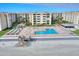 Aerial view showing beachside community amenities including pool and shuffleboard at 4175 S Atlantic Ave # 4070, New Smyrna Beach, FL 32169