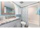 Bathroom with granite countertop and bathtub at 4175 S Atlantic Ave # 4070, New Smyrna Beach, FL 32169