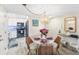 Charming dining area with round table and kitchen view at 4175 S Atlantic Ave # 4070, New Smyrna Beach, FL 32169