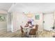 Bright dining room with round table, four chairs, and kitchen access at 4175 S Atlantic Ave # 4070, New Smyrna Beach, FL 32169