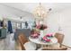Coastal dining area with round table and living room view at 4175 S Atlantic Ave # 4070, New Smyrna Beach, FL 32169