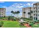 Oceanfront property with walkway, lush landscaping, and pool at 4175 S Atlantic Ave # 4070, New Smyrna Beach, FL 32169