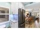 Modern kitchen with white cabinets, granite counters, and stainless steel appliances at 4175 S Atlantic Ave # 4070, New Smyrna Beach, FL 32169