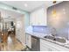Updated kitchen featuring white cabinets, granite countertops, and stainless steel appliances at 4175 S Atlantic Ave # 4070, New Smyrna Beach, FL 32169