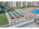 Relaxing pool area with shuffleboard and seating at 4175 S Atlantic Ave # 4070, New Smyrna Beach, FL 32169