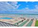 Oceanfront pool and deck with shuffleboard at 4175 S Atlantic Ave # 4070, New Smyrna Beach, FL 32169