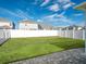 Backyard with grassy lawn and patio at 4567 Tribute Trl, Kissimmee, FL 34746