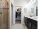 Bathroom with double vanity, shower, and walk-in closet at 4567 Tribute Trl, Kissimmee, FL 34746