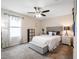 Bright bedroom with ceiling fan and window at 4567 Tribute Trl, Kissimmee, FL 34746