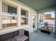 Screened porch with seating and backyard access at 4567 Tribute Trl, Kissimmee, FL 34746