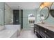 Elegant bathroom with a double vanity, soaking tub and walk-in shower at 4800 Pierce Arrow Dr, Apopka, FL 32712