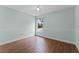 Light teal bedroom with wood-look floors and ceiling fan at 4800 Pierce Arrow Dr, Apopka, FL 32712