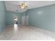 Bright bedroom featuring tile floors and access to bathroom at 4800 Pierce Arrow Dr, Apopka, FL 32712
