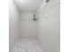 Large walk-in closet with wire shelving and white tile floor at 4800 Pierce Arrow Dr, Apopka, FL 32712