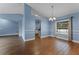 Dining area with hardwood floors and access to kitchen at 4800 Pierce Arrow Dr, Apopka, FL 32712