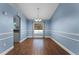 Bright dining room with hardwood floors and pool view at 4800 Pierce Arrow Dr, Apopka, FL 32712