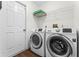 Laundry room with washer, dryer, and additional shelving at 4800 Pierce Arrow Dr, Apopka, FL 32712