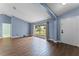 Bright living room with hardwood floors and large window at 4800 Pierce Arrow Dr, Apopka, FL 32712
