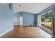 Living area with hardwood floors and blue walls at 4800 Pierce Arrow Dr, Apopka, FL 32712