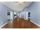 Spacious living area with access to the patio and kitchen at 4800 Pierce Arrow Dr, Apopka, FL 32712