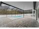 Inviting screened pool and patio area with gray pavers at 4800 Pierce Arrow Dr, Apopka, FL 32712
