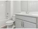 Bright bathroom featuring modern fixtures, toilet, shower, and vanity with ample storage at 5000 Northern Dove Ave, Mount Dora, FL 32757