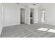 Well-lit bedroom with neutral carpet, multiple doorways and windows at 5000 Northern Dove Ave, Mount Dora, FL 32757