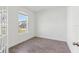 Bright bedroom with wood-look tile flooring and a large window offering a pleasant view at 5000 Northern Dove Ave, Mount Dora, FL 32757