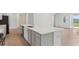 Open kitchen showcasing a large island, stainless steel appliances, and lots of sunlight at 5000 Northern Dove Ave, Mount Dora, FL 32757