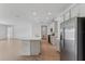 Well-equipped kitchen with stainless steel appliances, light gray cabinets, and a spacious layout at 5000 Northern Dove Ave, Mount Dora, FL 32757