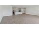 Bright and airy open concept living room and kitchen with modern tile flooring and breakfast bar seating at 5000 Northern Dove Ave, Mount Dora, FL 32757