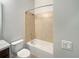 Clean bathroom with tub shower combo and neutral tile at 510 Rainbow Springs Loop, Groveland, FL 34736