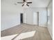 Simple bedroom with carpeted floors, neutral walls, and natural light at 510 Rainbow Springs Loop, Groveland, FL 34736