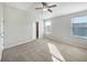 Bright and spacious bedroom with neutral carpeting and ceiling fan at 510 Rainbow Springs Loop, Groveland, FL 34736