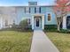 Two-story teal house with walkway and front yard at 510 Rainbow Springs Loop, Groveland, FL 34736