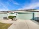 Attached garage with two car capacity and ample parking space at 510 Rainbow Springs Loop, Groveland, FL 34736