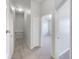 Upstairs hallway with carpet and access to bedrooms at 510 Rainbow Springs Loop, Groveland, FL 34736