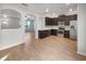 Modern kitchen featuring dark cabinetry and stainless steel appliances at 510 Rainbow Springs Loop, Groveland, FL 34736