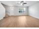 Spacious living room featuring hardwood floors and ample natural light at 510 Rainbow Springs Loop, Groveland, FL 34736
