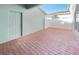 Brick paved patio with a storage door and privacy fence at 510 Rainbow Springs Loop, Groveland, FL 34736