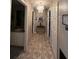 Bright hallway with tile flooring and access to other rooms at 517 Cardinal Dr, Kissimmee, FL 34759