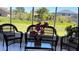 Relaxing sunroom with wicker furniture and backyard view at 517 Cardinal Dr, Kissimmee, FL 34759